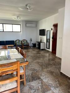 a living room with a table and chairs at no está activo in Salinas +3 photos