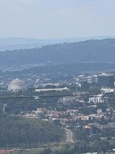an aerial view of a city with buildings at KiGALI CITY COMFORT ACCOMMODATION in Kigali
