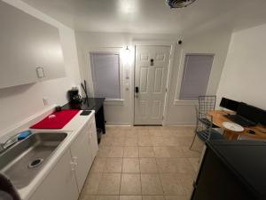 a kitchen with a sink and a counter top at Tree Star Motel in Monroeton