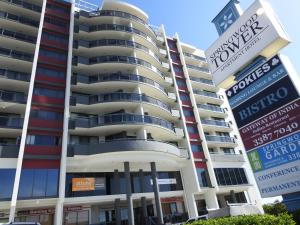 a building with signs in front of it at Springwood Tower Apartment Hotel in Springwood