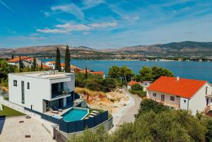 an aerial view of a house with a swimming pool at SEAPHORIA Luxury Modern Villa in Trogir