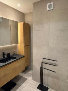 a kitchen with a sink and a refrigerator at Spacious duplex apartment in Overijse in Overijse