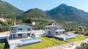 an aerial view of a house with mountains in the background at Villa Palomar in Kyparissia