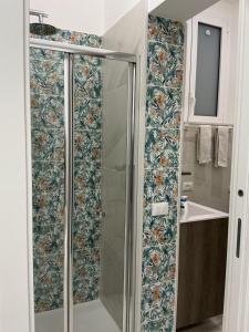 a shower with a glass door in a bathroom at Crispi Accomodation B&B in Catania +28 photos