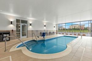 a pool in a building with a swimming pool at SpringHill Suites by Marriott Columbus West in Columbus