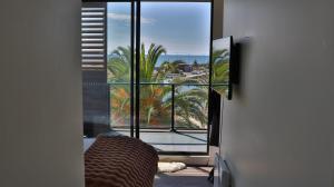 a room with a window with a view of the ocean at Beach paradise in Werribee South +7 photos