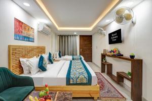a bedroom with a large bed in a room at Hotel Ashram View With Luxury Near Nizamuddin Railway Station in New Delhi