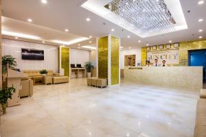 a lobby of a hotel with a waiting area at Sun City Hotel in Nha Trang