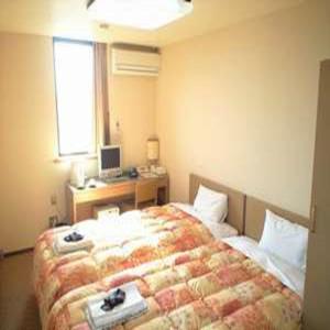 Postel nebo postele na pokoji v ubytování Hotel Kimitsu Hills
