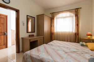 Ein Bett oder Betten in einem Zimmer der Unterkunft SeaFront Apartment Marsascala
