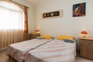 Ein Bett oder Betten in einem Zimmer der Unterkunft SeaFront Apartment Marsascala