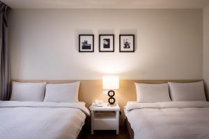 Voodi või voodid majutusasutuse Wemeet Hotel Taipei toas