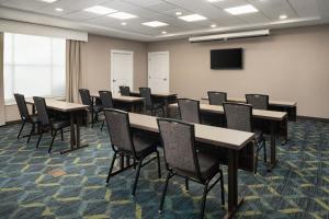 a conference room with tables and chairs and a tv at Residence Inn by Marriott Springfield Chicopee in Chicopee +41 photos