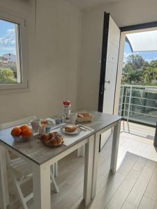 a table with food on it in a room with a window at Casa Giulia in Niscemi