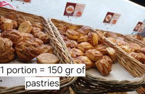 two baskets filled with different types of pastries at Chisinau Hotel in Chişinău
