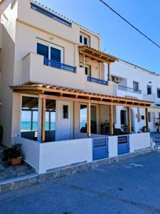 a building with a view of the ocean at Almiriki- Ground Floor Seafront Studio in Elafonisos