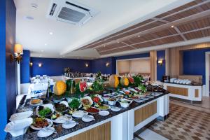 a buffet line with plates of food on it at Quadas Hotel - Adult Only in Marmaris +19 photos