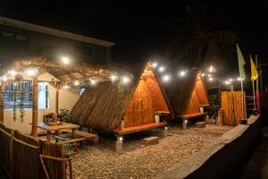 a group of three tents with lights on them at CocoHaus in Batangas City