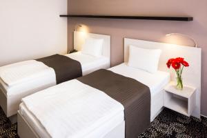 Łóżko lub łóżka w pokoju w obiekcie Parkhotel Plzen Congress Center