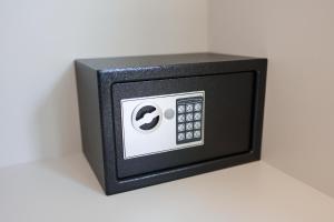 a black box with a clock on a white wall at Mondeso Hotel in Aš