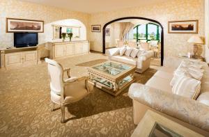 a living room filled with furniture and decor at Hasdrubal Thalassa & Spa Port El Kantaoui in Port El Kantaoui