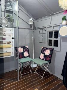 two chairs and a lamp in a shed at Day&Night Stay in Johannesburg