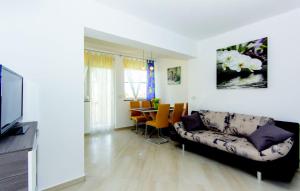 a living room with a couch and a table at Apartment Vilic in Pula