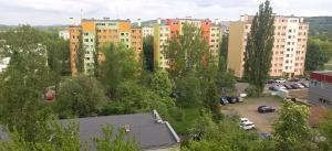 a view of a city with buildings and a parking lot at Apartament 7 Piętro in Wałbrzych