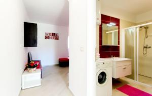 a bathroom with a washing machine and a sink at Apartment Vilic in Pula +45 photos