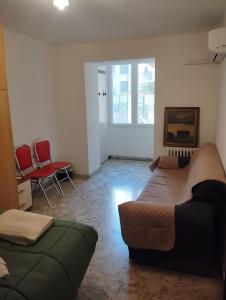 a living room with two beds and a couch at Al Castello 2 in Bari