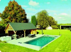a house with a swimming pool in the yard at Il Giardino Segreto in Waterloo
