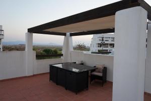 A balcony or terrace at 2 bed apartment on Condado De Alhama with roof solarium N5