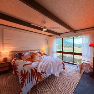 a bedroom with a bed with a large window at Southern Grampians Lookout in Dunkeld