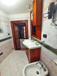 a bathroom with a sink and a toilet at Meraviglie Salentine in Lequile
