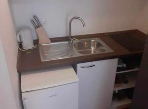 a kitchen with a sink and a counter top at Villa Ivan Vodice in Vodice