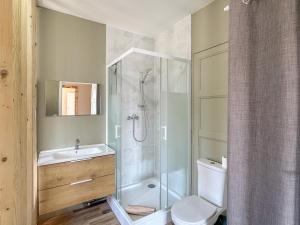 a bathroom with a shower and a toilet and a sink at Chez La Mamie in Saint-Jean-de Niost +12 photos