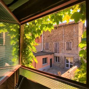 a view of a building from a window at Locanda Amerigo in Savigno