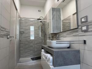 a bathroom with a sink and a shower at EDEL Vacation Home in Terni +30 photos