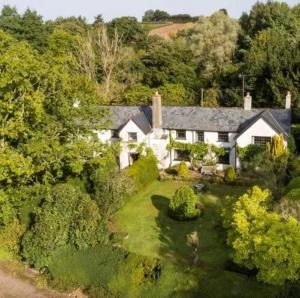 an aerial view of a house with a garden at The Annexe Lurley Manor in Tiverton