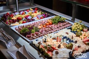 a buffet filled with lots of different types of food at Mondeso Hotel in Aš