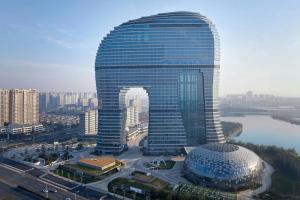 a large building with a dome in front of it at Huzhou Marriott Hotel Nanxun in Huzhou