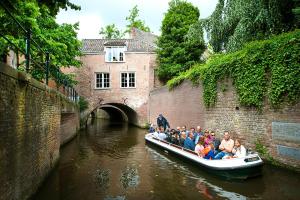 a group of people on a boat in a canal at Le Diez Boutique Hotel in Den Bosch