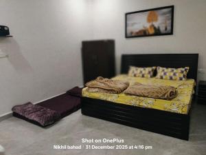 a bedroom with a bed with a bed sidx sidx sidx at aasara resort in Bhopal