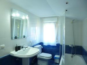 a bathroom with a sink and a toilet and a shower at Los campos in Hontoria +20 photos