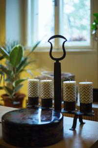 a candle holder with candles on a table at 0.3 Stanze in Trieste