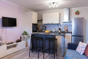 a kitchen with a large island in a room at Emma in Krasica +12 photos