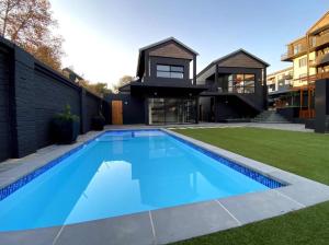 a swimming pool in the backyard of a house at 95 Yang Suite A in Johannesburg