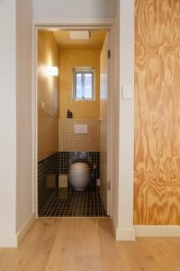 a bathroom with a bath tub in a room at Kodok House in Melbourne +17 photos