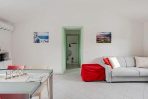 a white living room with a couch and a table at Sunset Apartment 2Bedr Sunset View Parking in Bosa