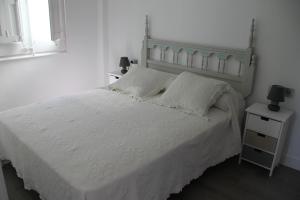 A bed or beds in a room at Apoteka apartaments